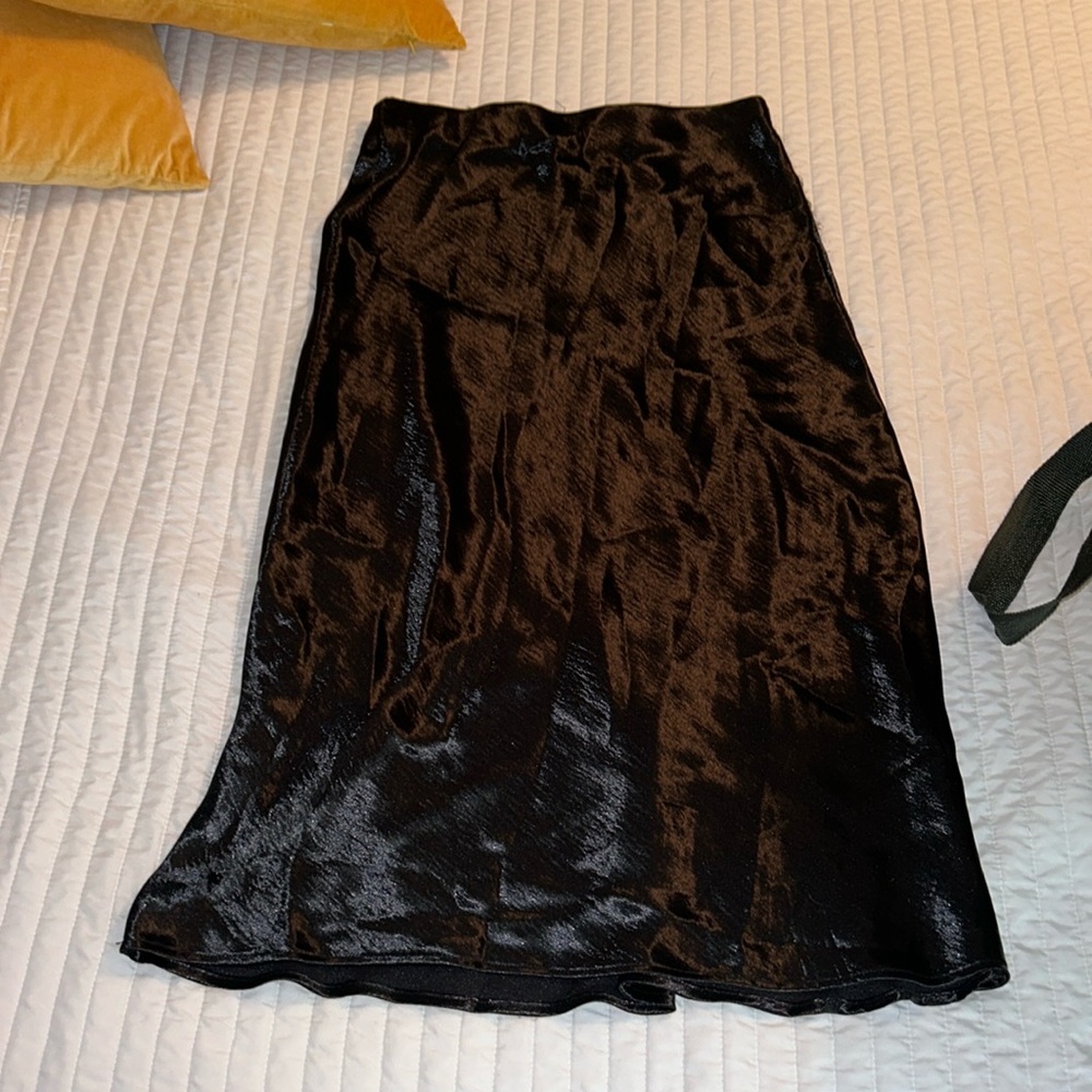 Black satin skirt.